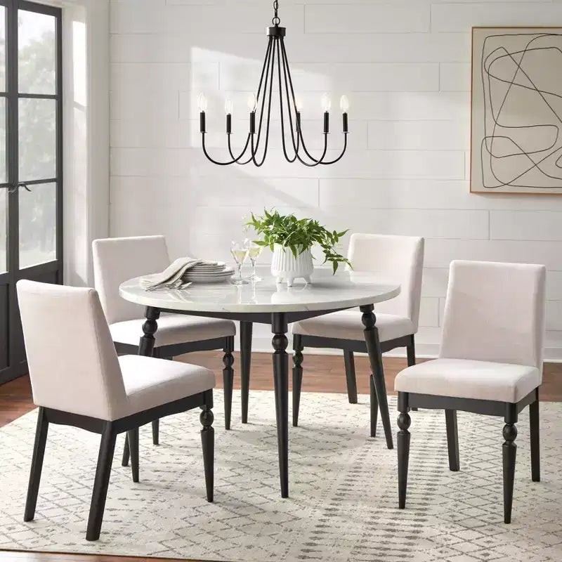 Table à manger ronde Lifestorey Bertona en faux marbre, 117 cm, avec pieds fuseau noirs